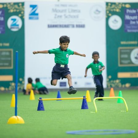 Child building gross motor skills and balance through play at home