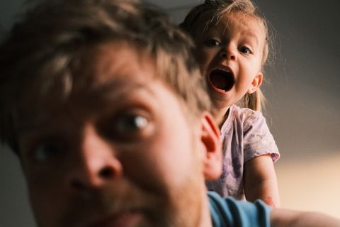 Parent learning occupational therapy techniques to support their child at home