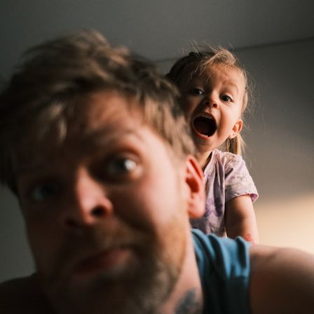 Parent learning occupational therapy techniques to support their child at home